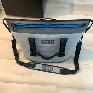 Yeti soft cooler larger version holds 40 cans.